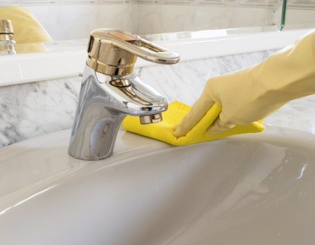 Local technician cleaning a sectional sofa in Bayswater